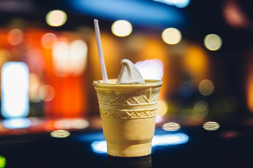 Vibrant Soft-Serve Ice Cream in Golden Cone - Colorful Wallpaper