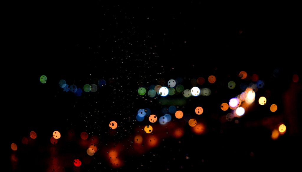 Colorful Bokeh Cityscape Wallpaper with Water Drops - Dark Background