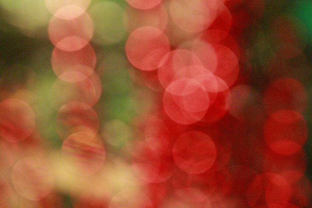 Vibrant Bokeh Wallpaper: Festive Red & Green Light Patterns