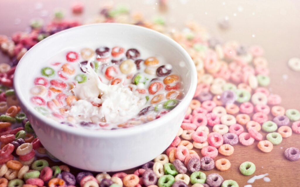 Colorful Breakfast Wallpaper: Milk Bowl & Ringlets on Wood