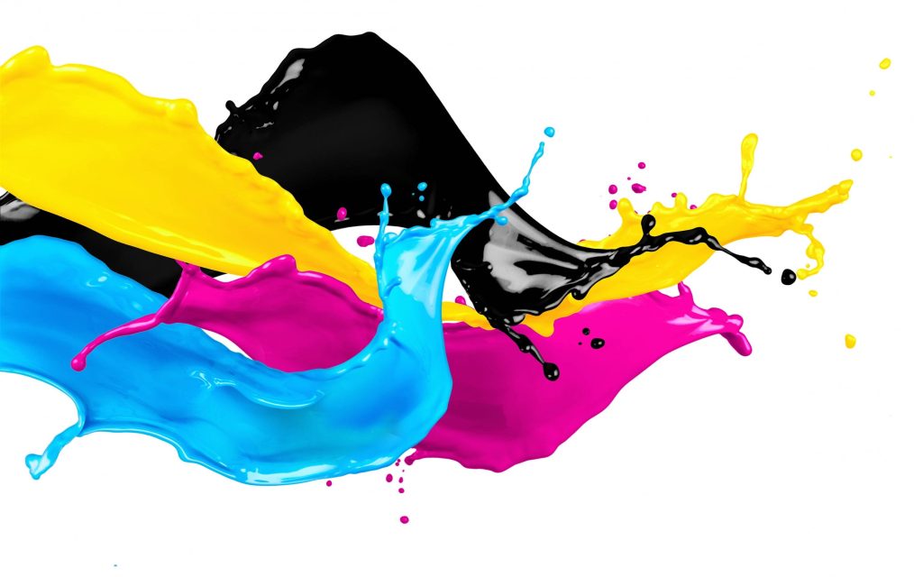 Colorful CMYK paint splashes in fluid motion on white background vibrant creative wallpaper