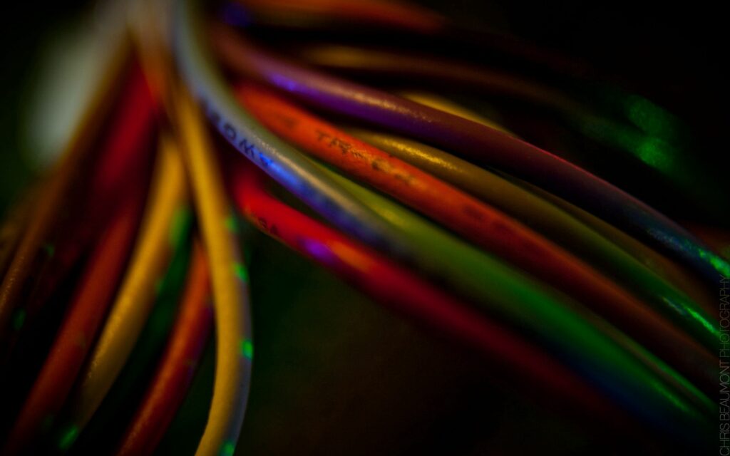 Vibrant Close-Up of Colorful Cables: Textured Wallpaper Background
