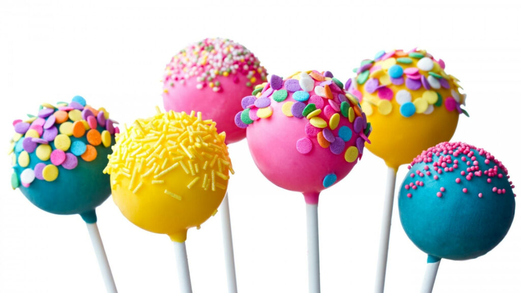 Colorful Cake Pop Wallpaper: Playful Sprinkles on Vibrant Background