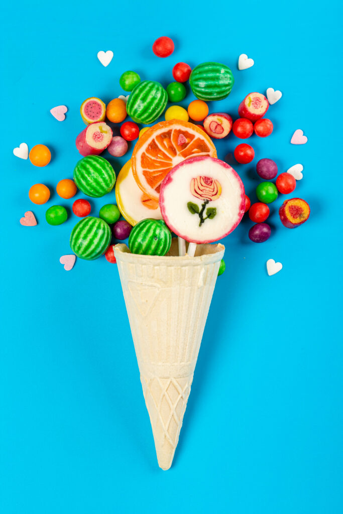 Colorful Lollipop & Candy Wallpaper on Vibrant Blue Background