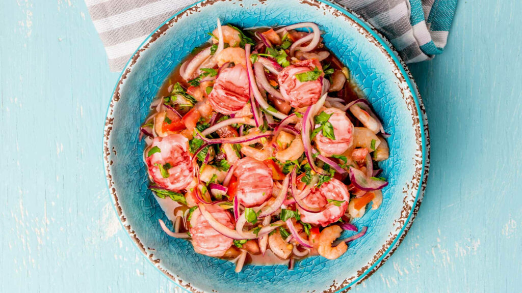 Vibrant Ceviche in Rustic Blue Bowl - Colorful Seafood Wallpaper