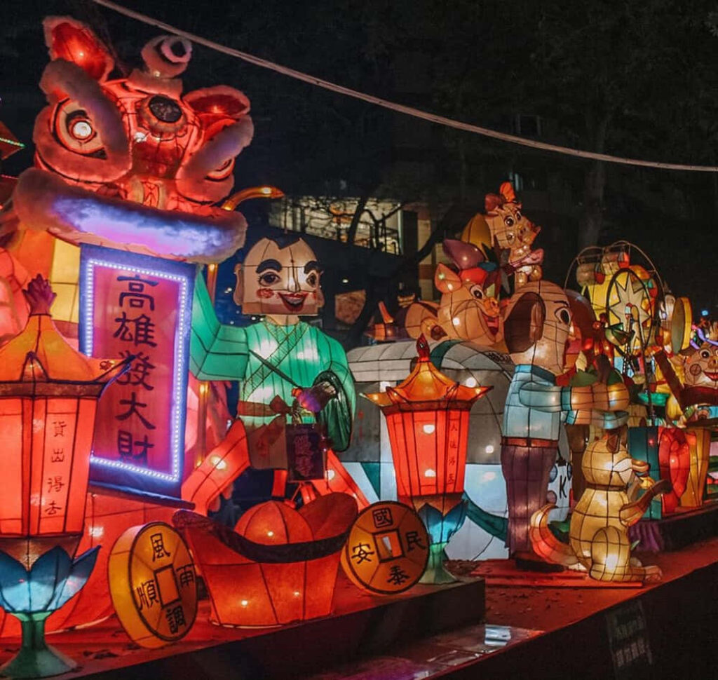 Colorful Chinese New Year lanterns and festive figures brightening a joyful celebration scene Wallpaper
