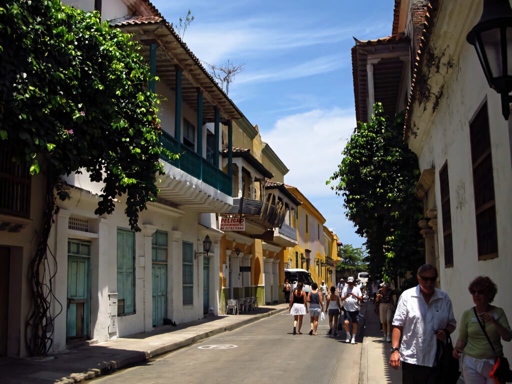 Colonial buildings in Cartagena Colombia with colorful facades wooden balconies and greenery Wallpaper
