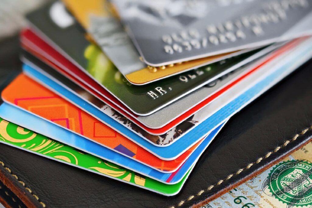 Close-up of colorful credit cards fanned on leather wallet highlighting secure payment options Wallpaper