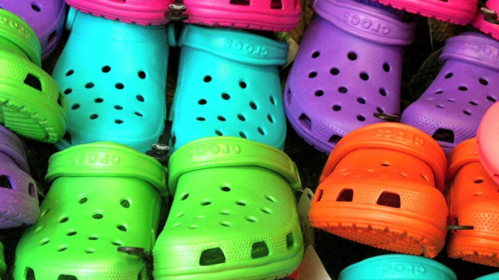 Vibrant Assortment: Celebrating the Diverse Style and Unmatched Comfort of Crocs Shoes Wallpaper