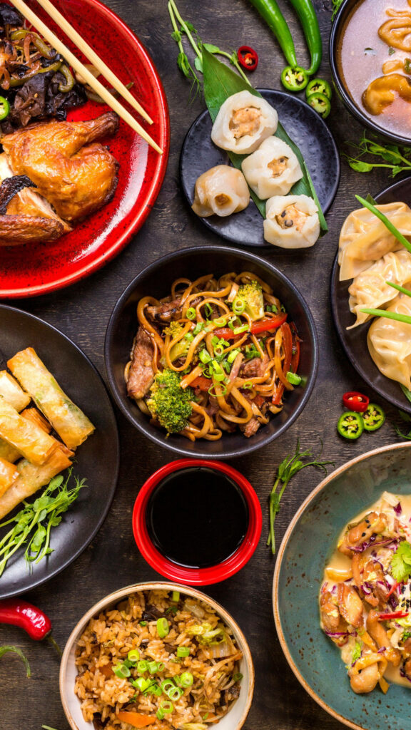 Colorful Savory Dishes on Rustic Table - Vibrant Wallpaper Background