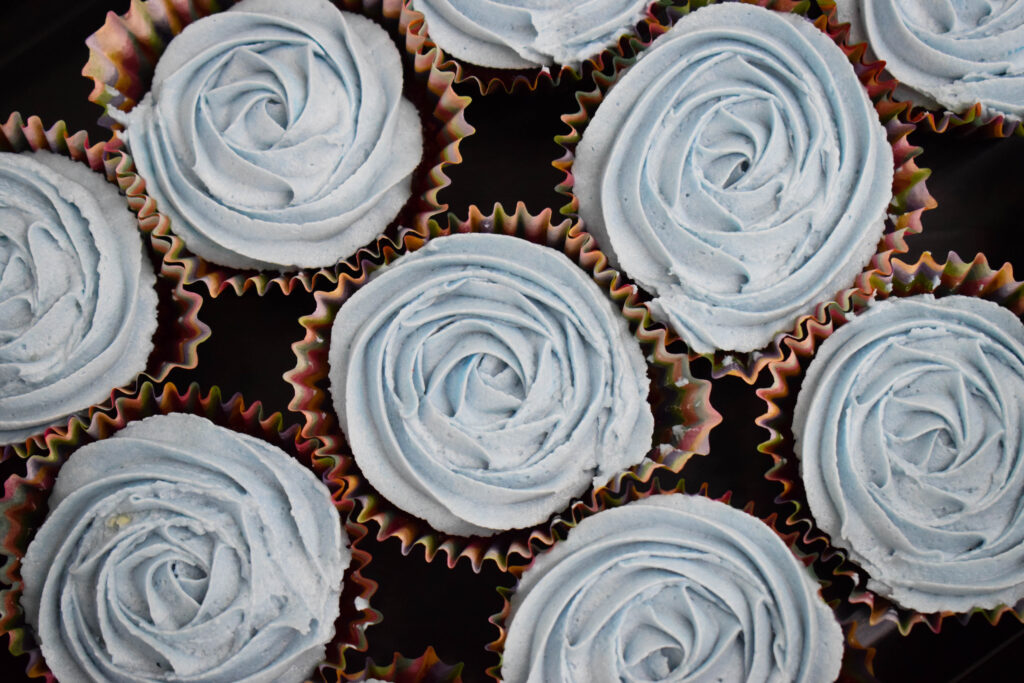 Colorful Cupcake Wallpaper: Rose-Swirled Blue Frosting Delight
