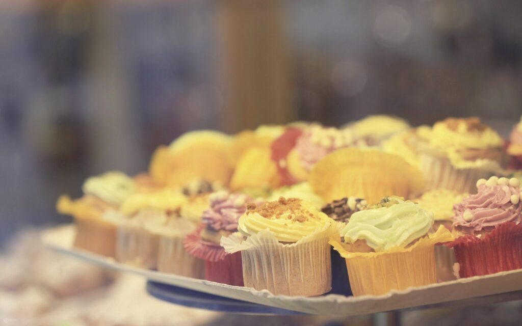 Colorful Cupcake Wallpaper: Vibrant Frosting & Toppings Display