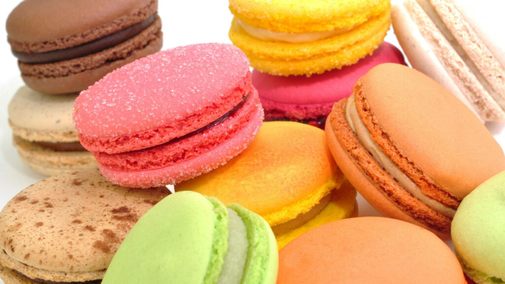 Delightful Delicacies: A Rainbow of Irresistible Macarons Wallpaper
