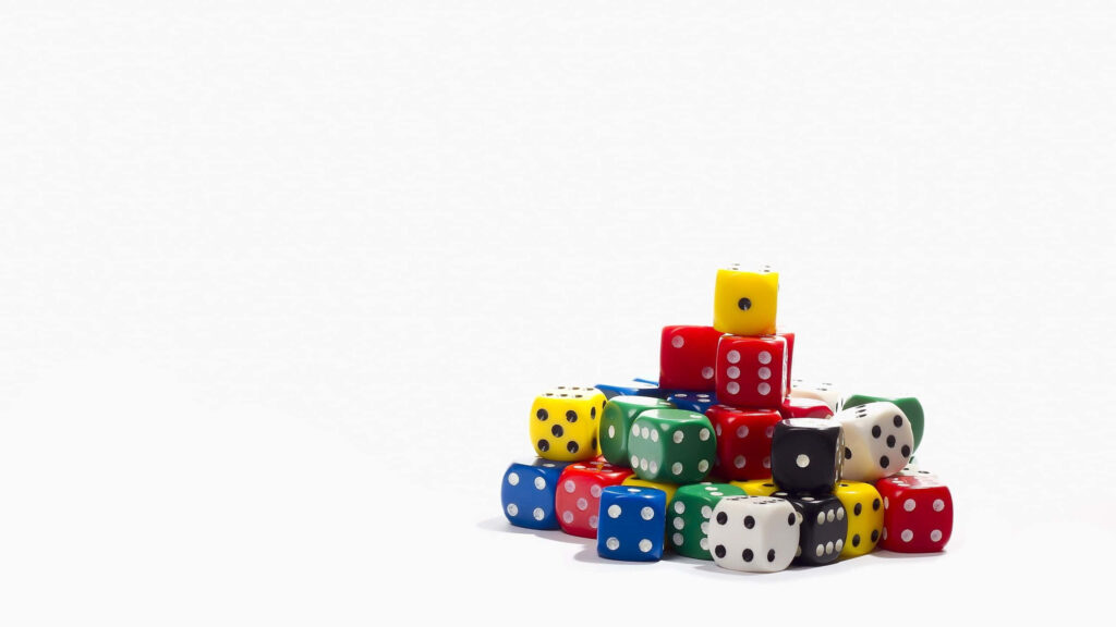 Colorful glossy dice pile on white background showcasing chance and playful fun minimalistic style Wallpaper