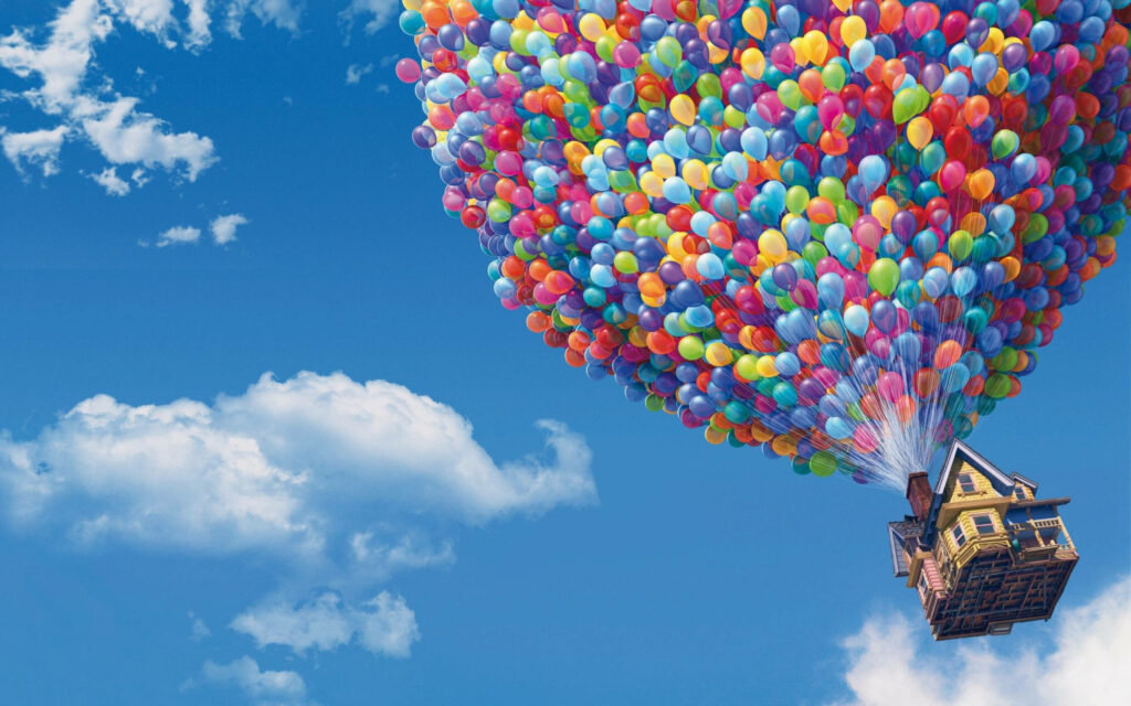 Vibrant Disney Up Laptop Wallpaper: Colorful Balloons & Clouds