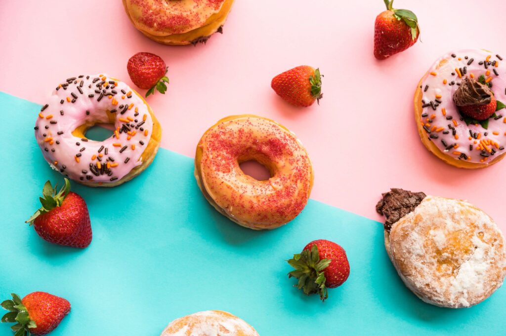 Colorful Donuts & Fresh Berries Wallpaper: Delightful Dessert Decor
