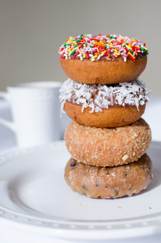 Delicious Donuts with Colorful Sprinkles: Tempting Breakfast Wallpaper