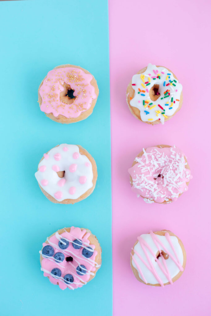 Colorful Doughnut Wallpaper: Cute Treats on Pastel Pink & Blue