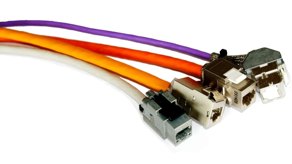 Colorful Ethernet cables with metallic connectors on white background representing modern networking Wallpaper