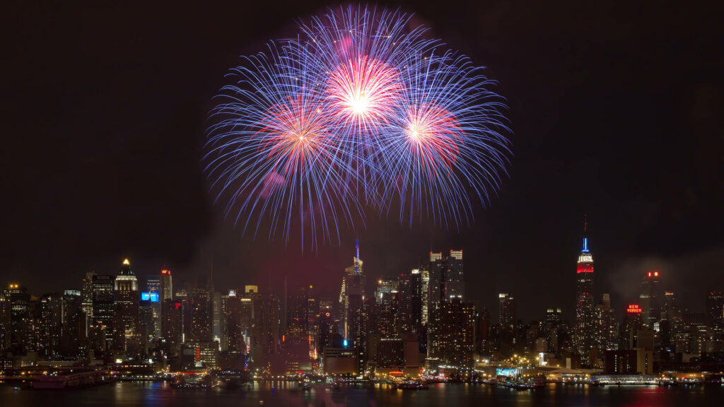 Vibrant NYC Skyline: Colorful Fireworks Wallpaper Background