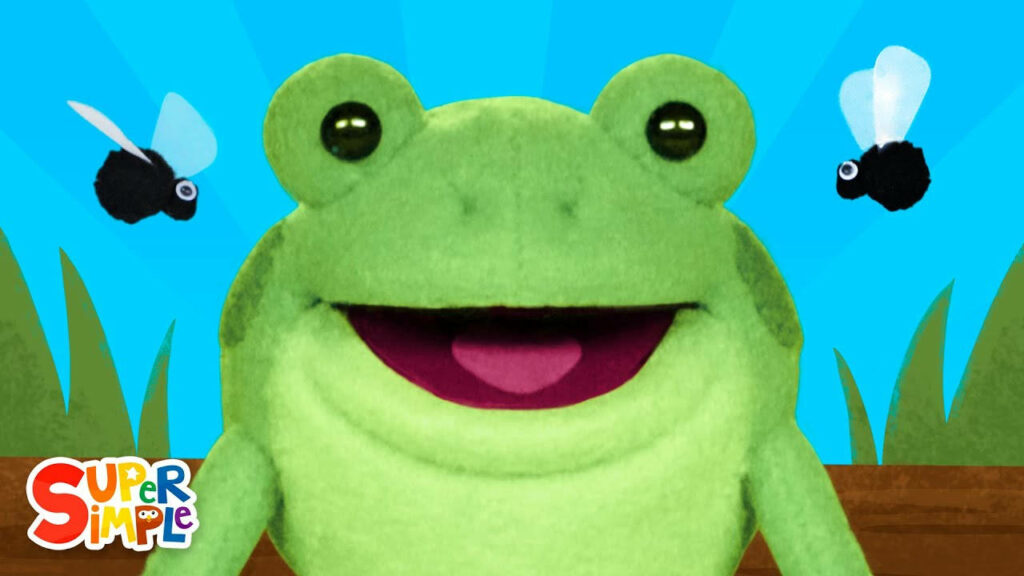 Whimsical Frog Puppet Wallpaper with Fun Flies & Bright Blue Background