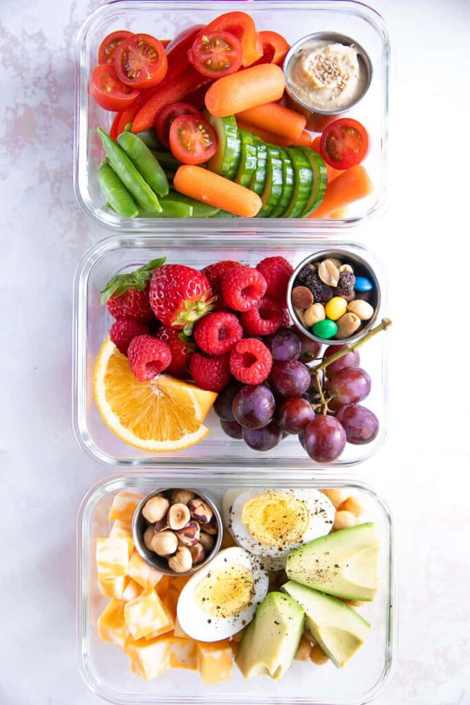 Vibrant Healthy Meal: Fresh Fruits & Veggies on Wooden Table Wallpaper