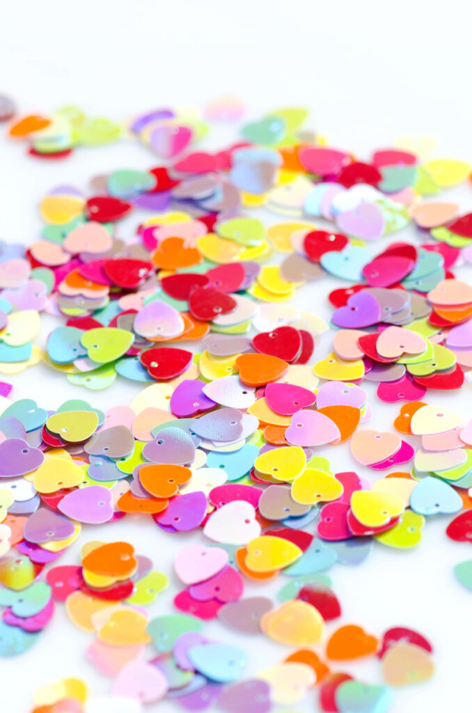 Colorful Heart-Shaped Confetti Wallpaper Background for Romance & Joy