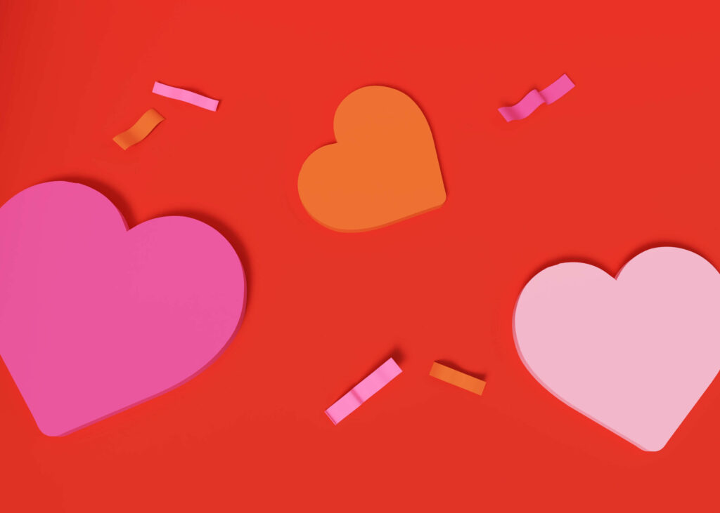 Colorful Heart Wallpaper: Festive Red & Orange Design with Ribbons