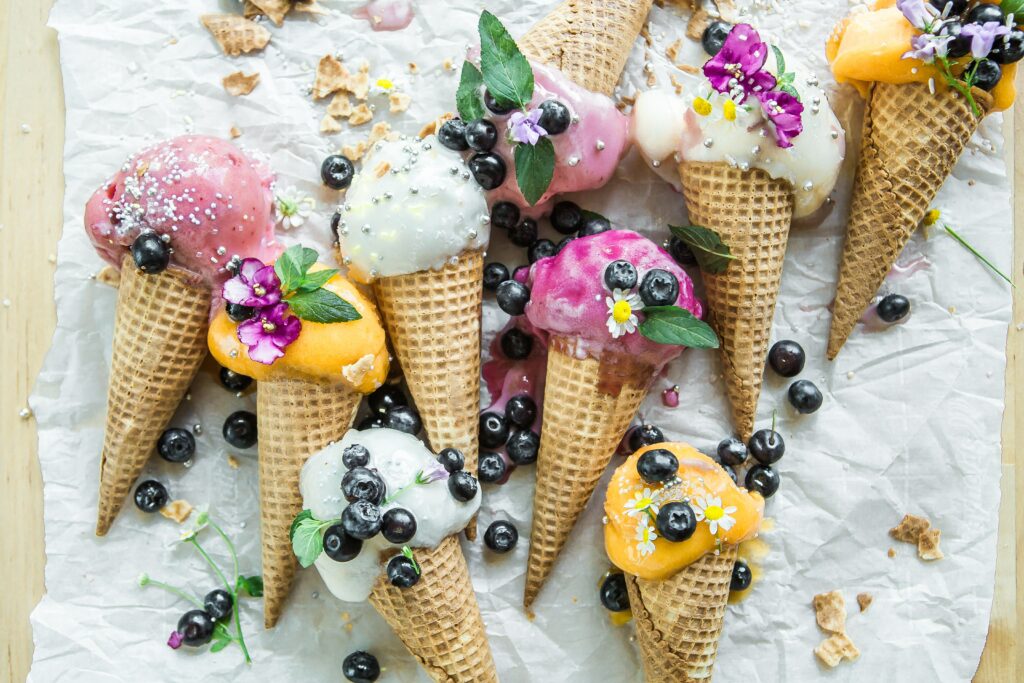 Vibrant Ice Cream Cone Wallpaper with Berries & Flowers