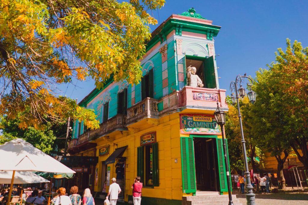 Colorful La Boca District Buenos Aires mural with vibrant historic buildings and lively street scene Wallpaper