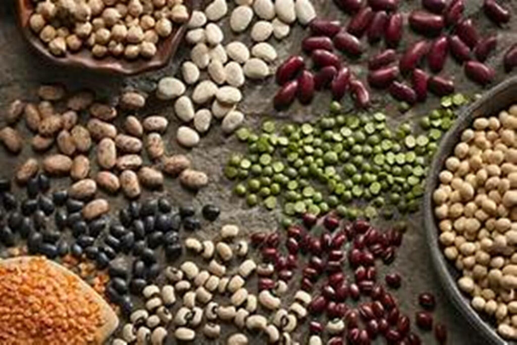Vibrant Legume Wallpaper: Colorful Beans & Lentils on Rustic Surface