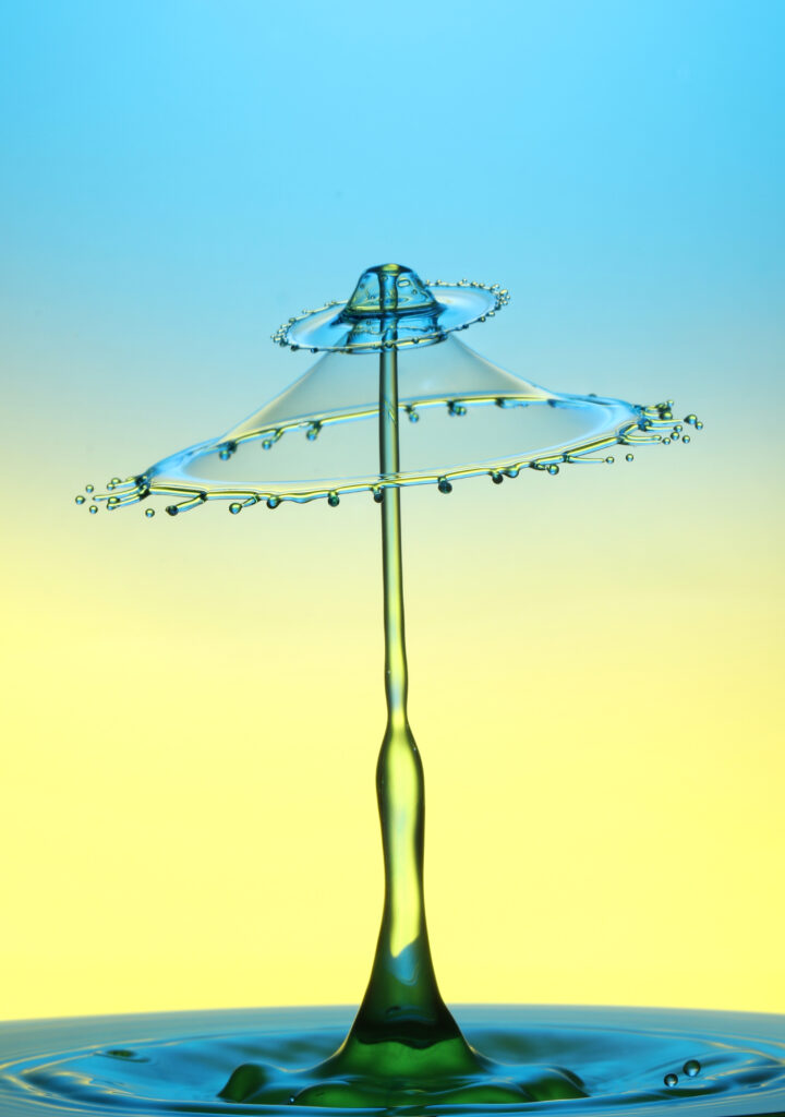 Stunning Macro Liquid Splash Wallpaper: Colorful Umbrella Design