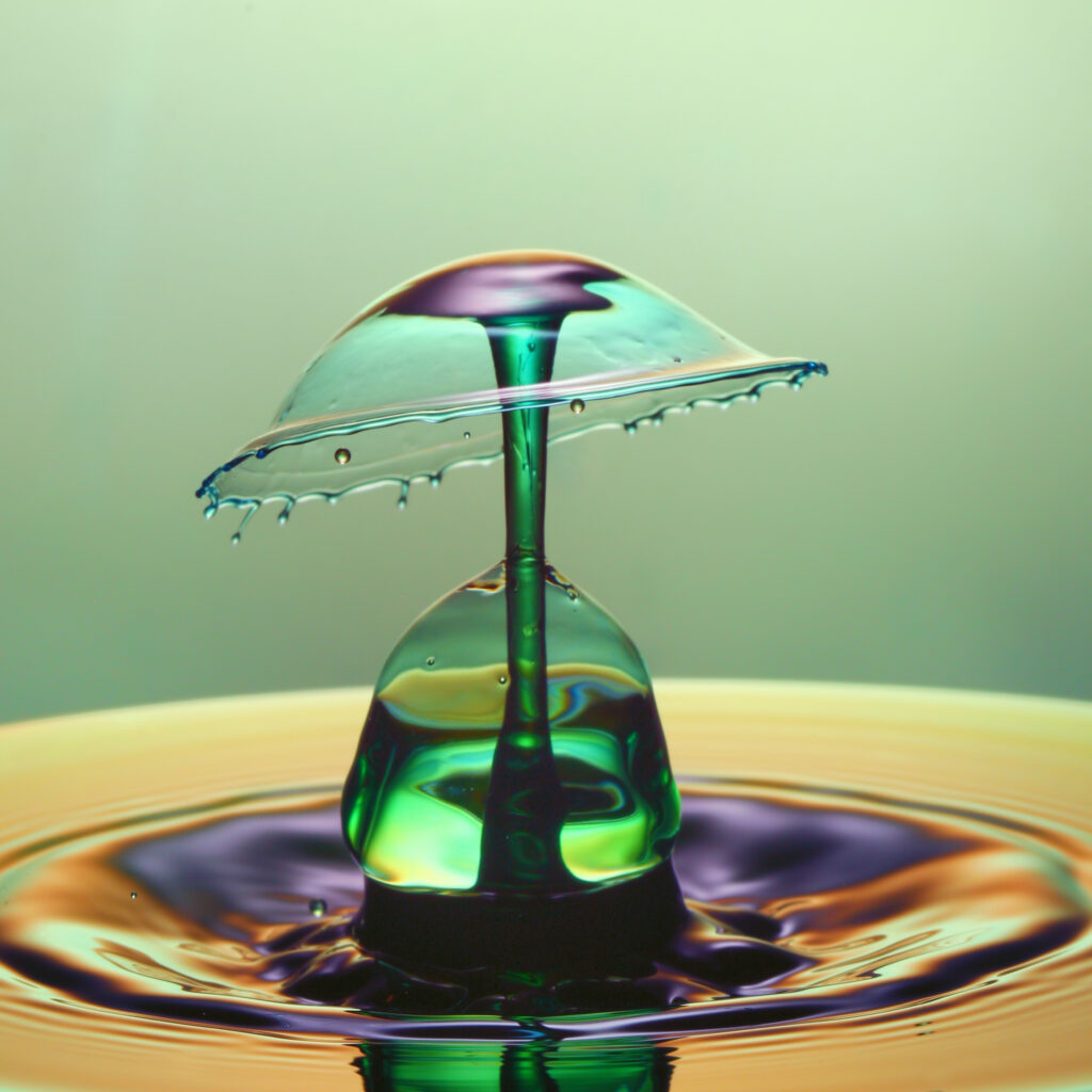 Vibrant Liquid Splash Wallpaper: Colorful Umbrella Design Background