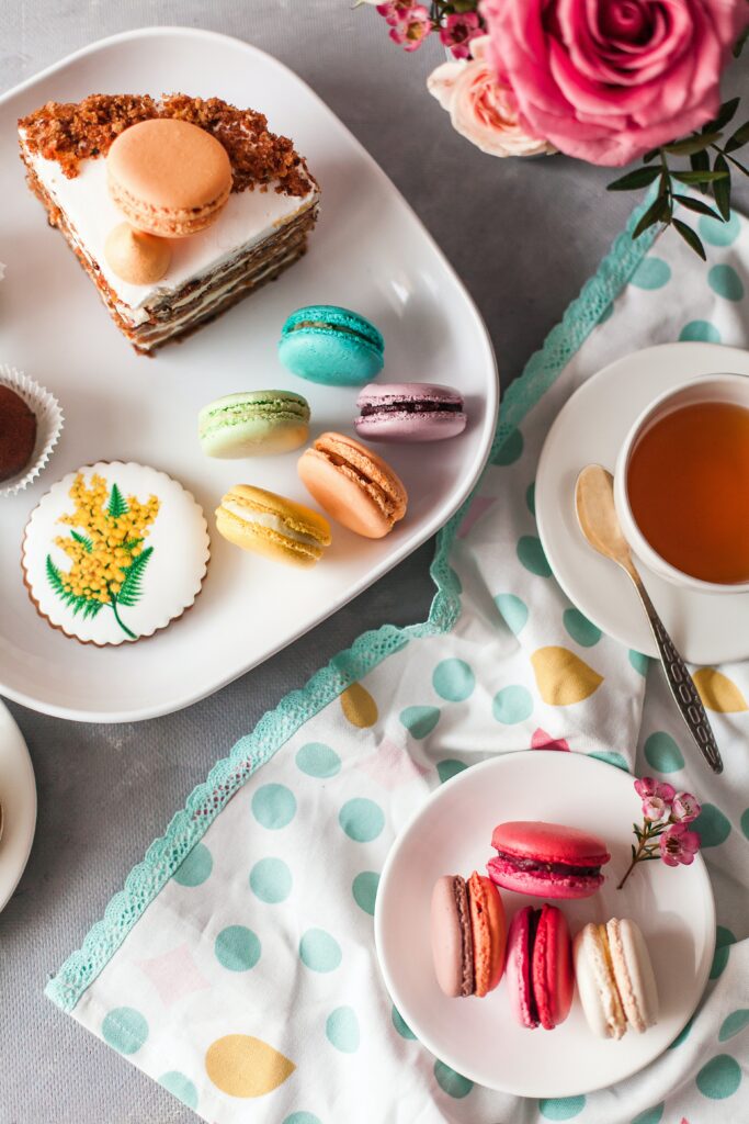 Colorful Macarons & Cake: Elegant Still Life Wallpaper Background