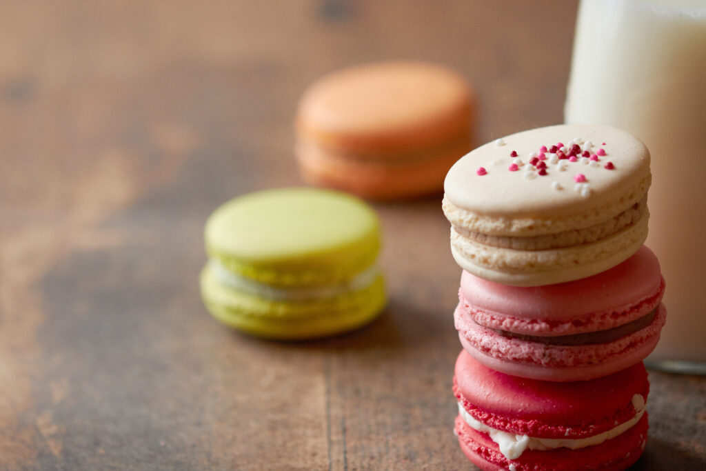 Colorful Macarons Close-Up: Elegant French Treats Wallpaper Background