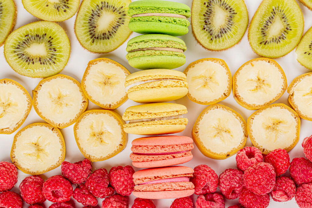 Vibrant Macarons, Cookies & Fruits Wallpaper Background