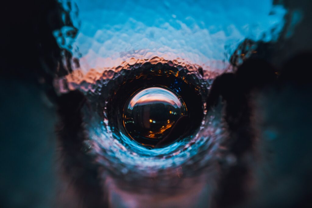 Vibrant Macro Water Drop Wallpaper: Colorful Abstract Reflections
