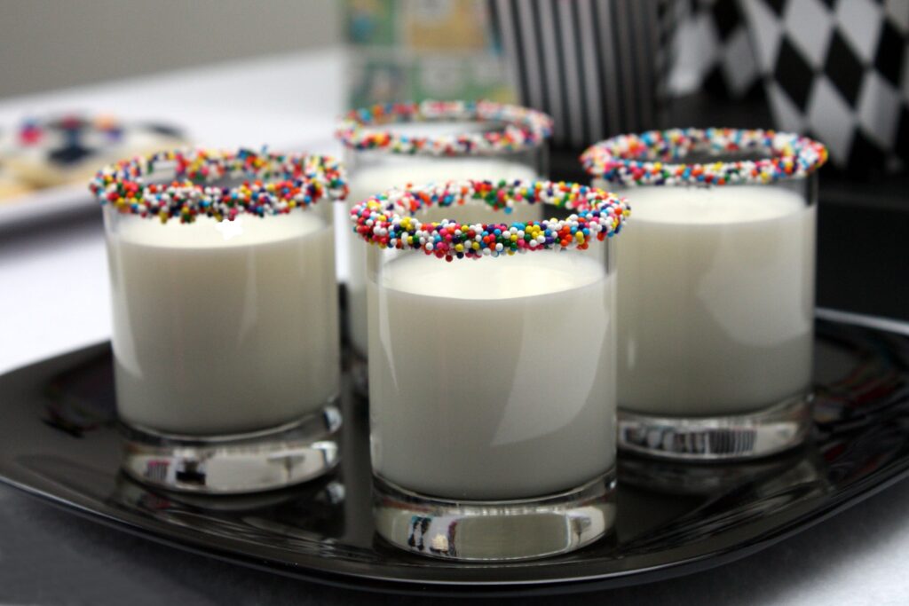 Colorful Milk Glasses Wallpaper with Sweet Sprinkles | Decorative Background