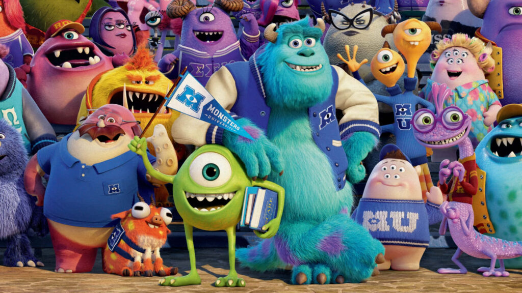 Vibrant *Monsters Inc* Wallpaper: Sulley & Mike Wazowski Celebrate!