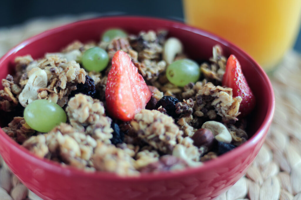 Colorful Fruit-Topped Muesli Bowl: A Nutritious Breakfast Wallpaper