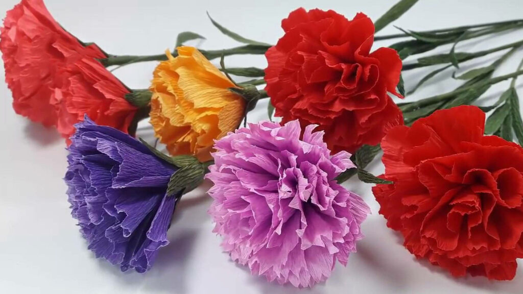 Vibrant Wallpaper: Colorful Paper Carnations on Light Background
