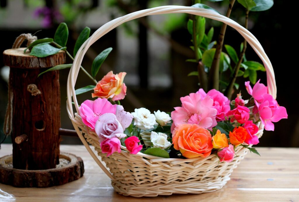 Vibrant Roses in Basket - Lush Garden Wallpaper Background