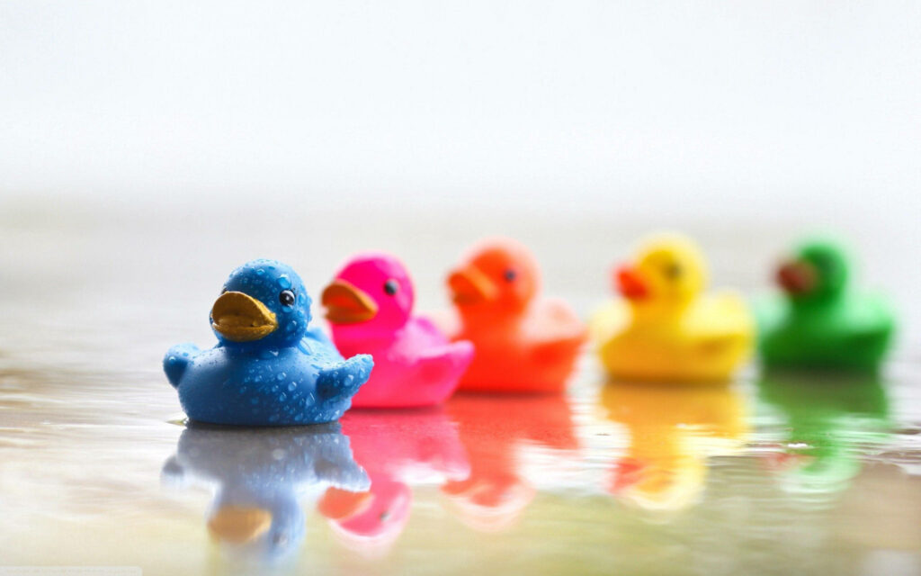 Colorful Rubber Ducks Wallpaper: Cheerful Background in Vibrant Hues