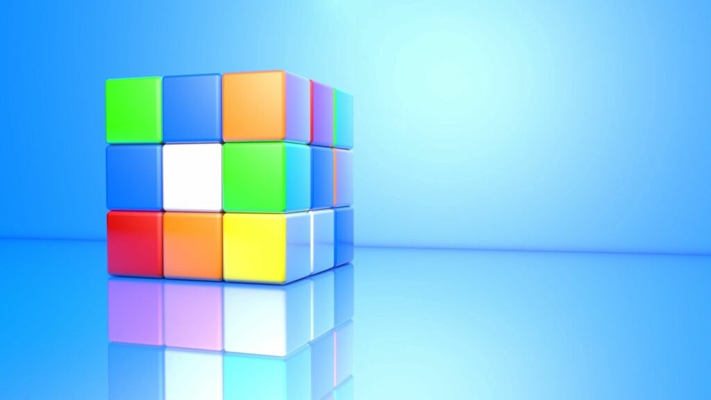 Vibrant 1920x1080 Rubik's Cube Wallpaper with Blue Gradient Background
