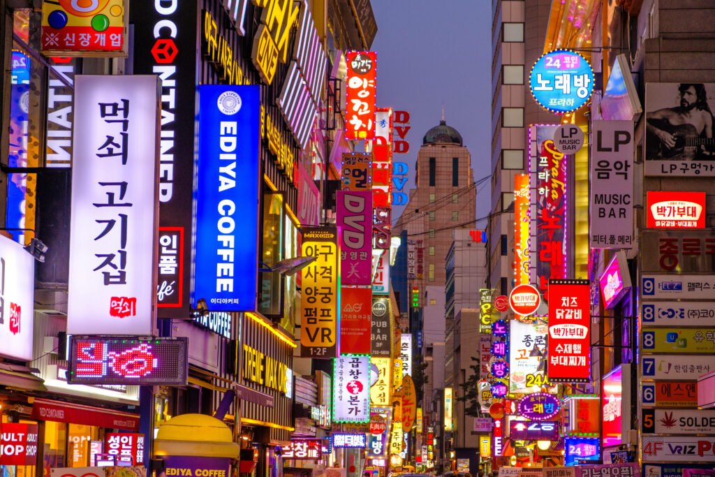 Vibrant Seoul Wallpaper: Illuminated Colorful Shop Signs & City Life