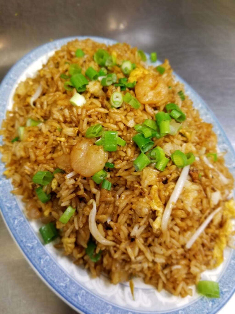 Colorful Shrimp Fried Rice on Patterned Dish - Savory Wallpaper Background