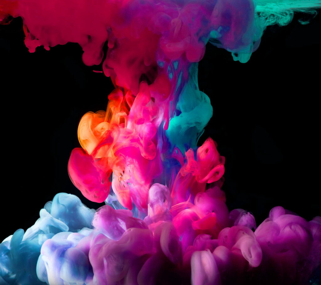 Celestial Symphony: Captivating HD Wallpaper Revealing a Vibrant Multicolored Smoke Cloud Dance