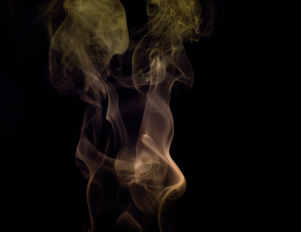 Graceful Swirls of Colored Smoke Wallpaper - Mysterious Dark Background
