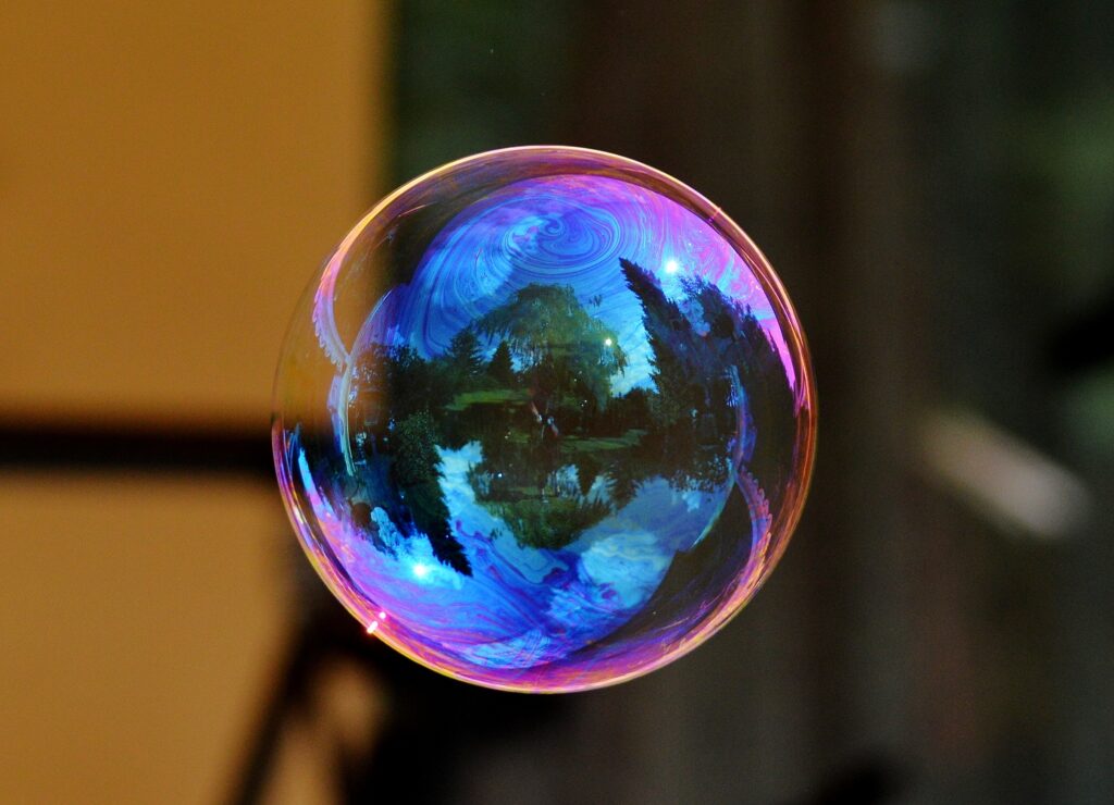 Mesmerizing Colorful Soap Bubble Wallpaper with Scenic Reflection