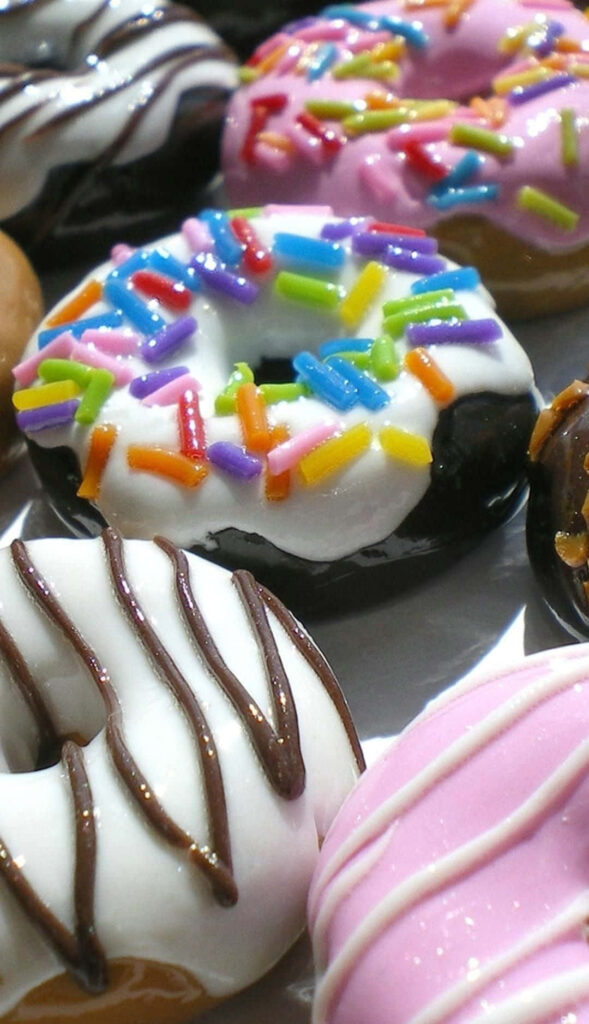 Colorful Donut Wallpaper: Mouthwatering Sprinkles & Drizzles Delight